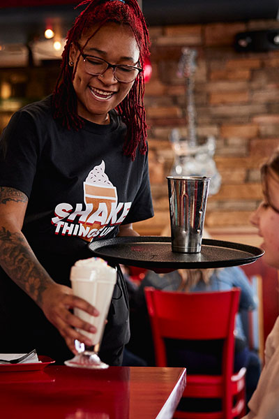 Team Member serving up a Gourmet Milkshake